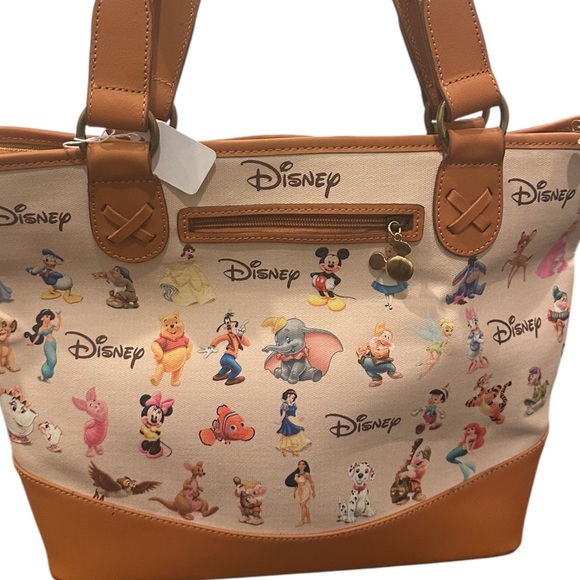 Disney Handbags - Disney Character Print Tan and Cream hand bag